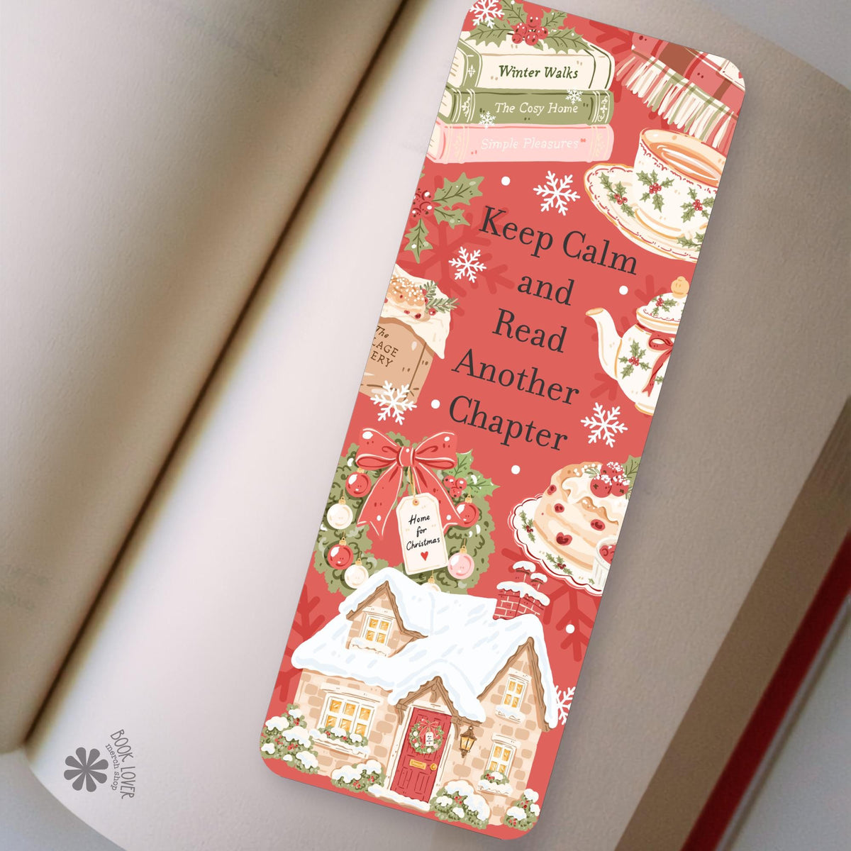 Christmas Cottage Tea bookmark in an open book, cozy reading