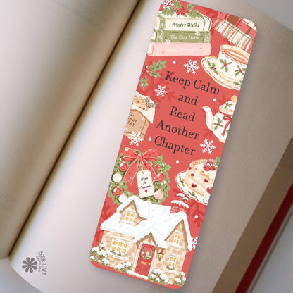 Christmas Cottage Tea bookmark in an open book, cozy reading