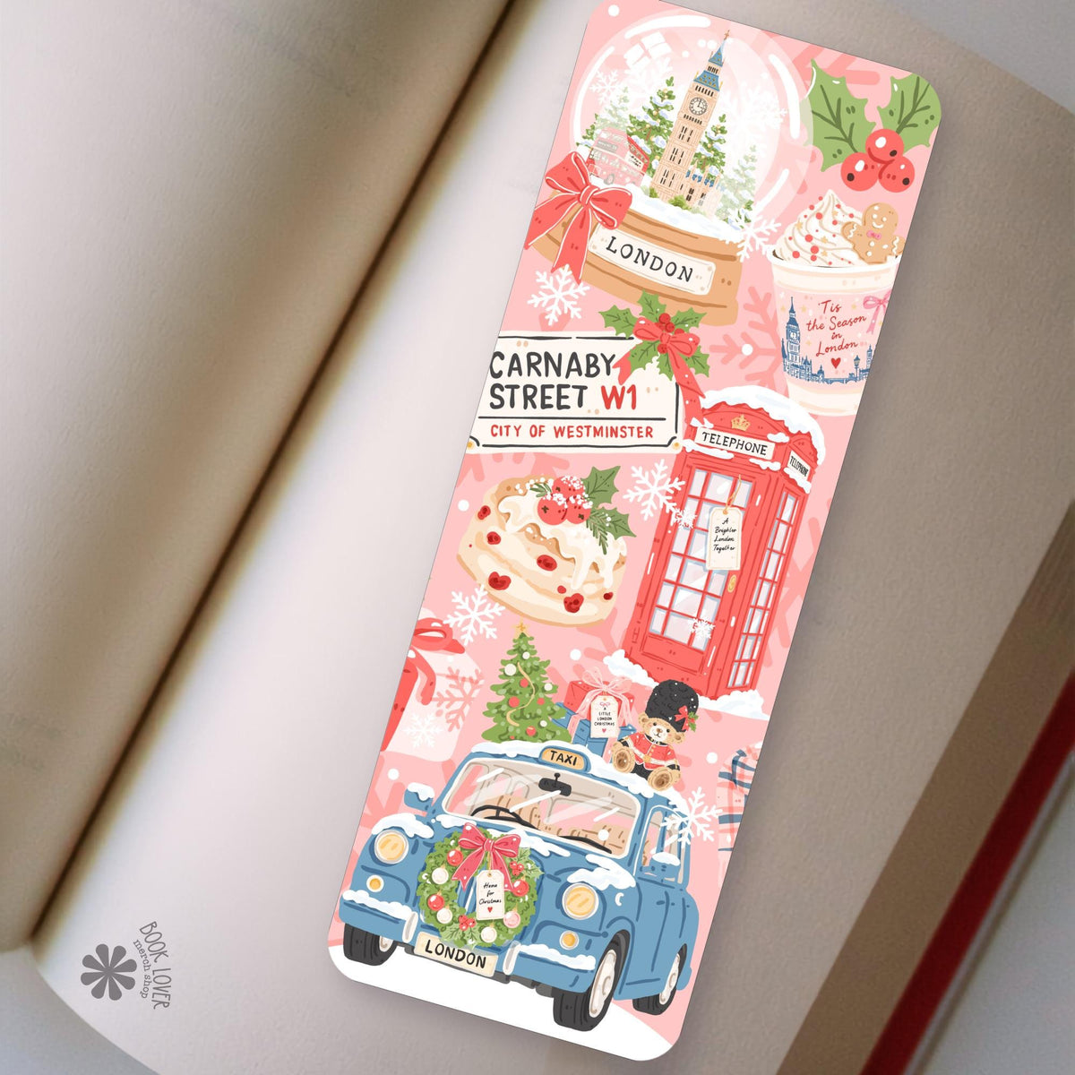 London Christmas bookmark in an open book, cozy reading