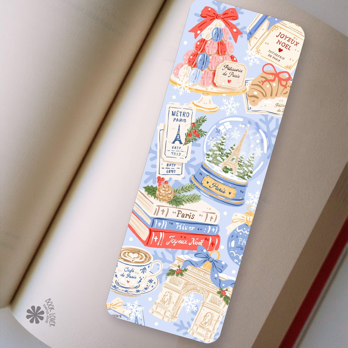 Paris Christmas bookmark in an open book, cozy reading