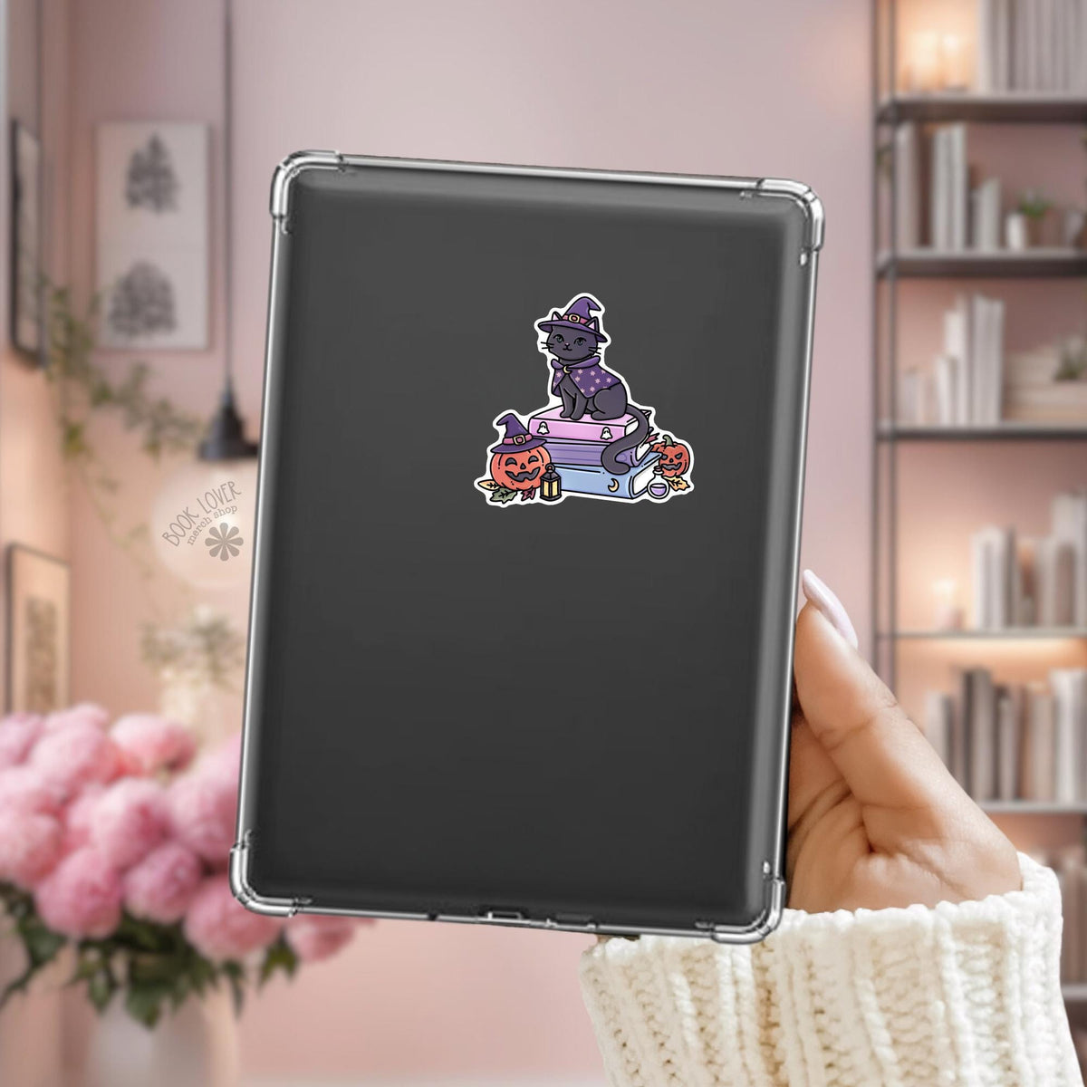 Witchy black cat Kindle sticker on desk, bookish cat decal