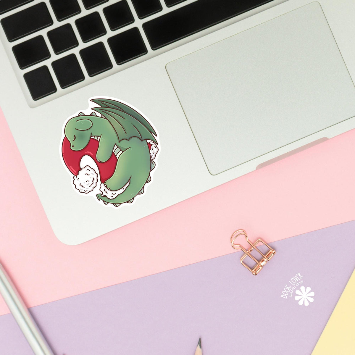 Sleepy Dragon Santa Hat sticker close up, matte finish, book lover vinyl decal