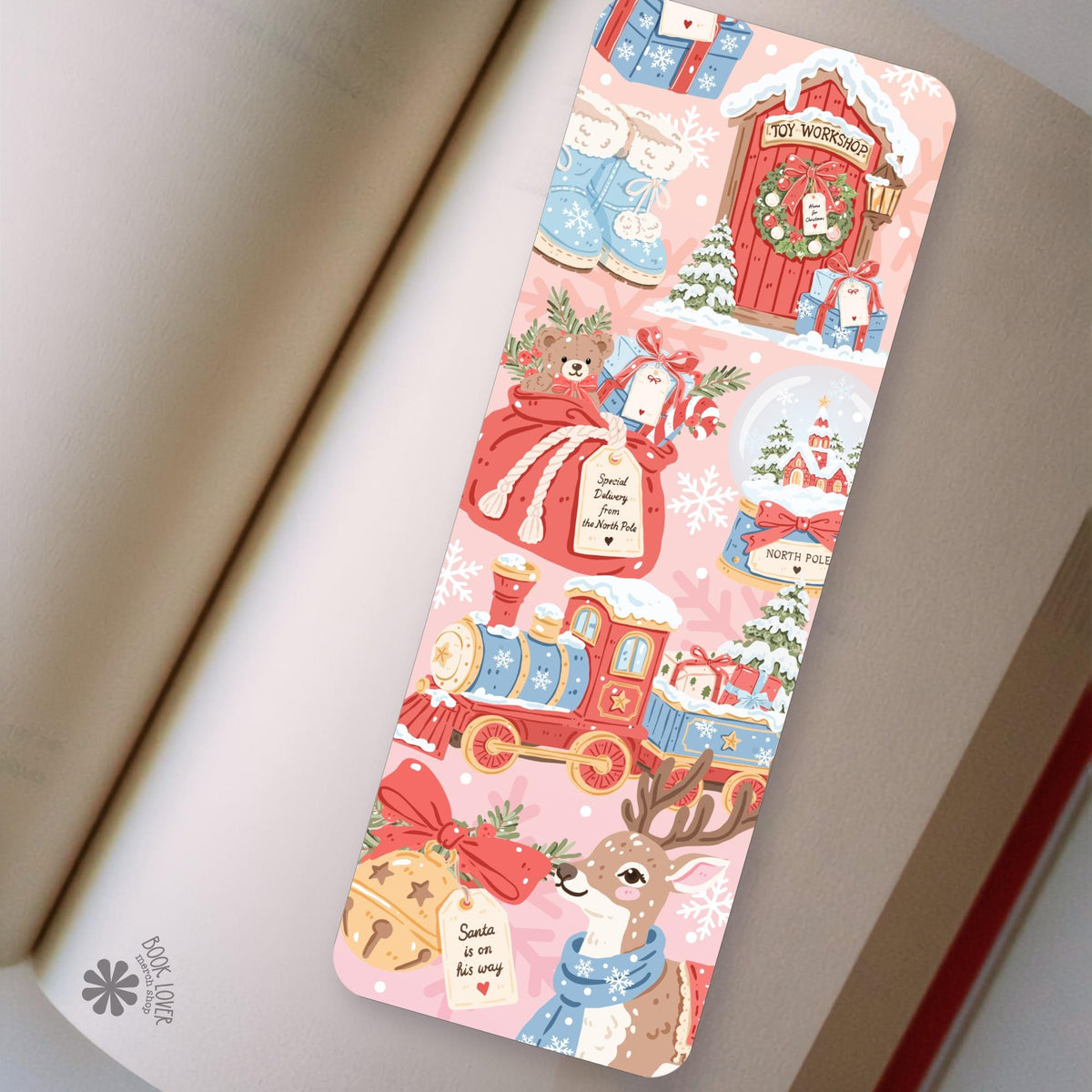North Pole Workshop bookmark in an open book, cozy reading