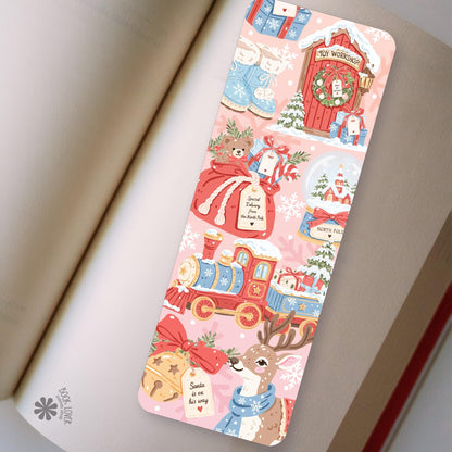 North Pole Workshop bookmark in an open book, cozy reading