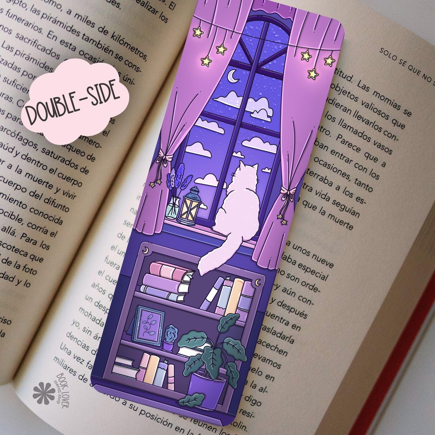 Back of double-sided purple cat bookmark with moonlit window scene